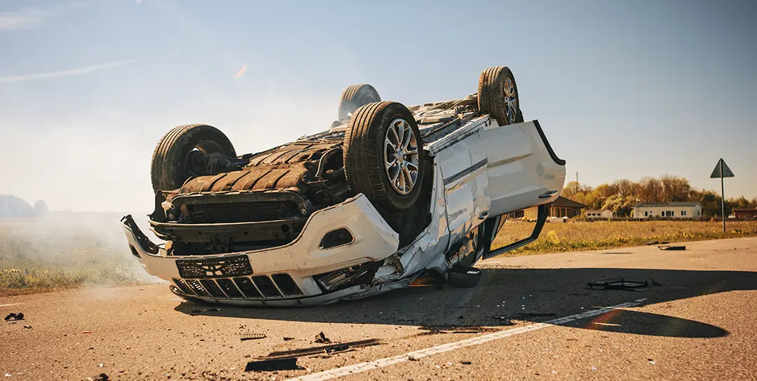 Jeep upside down on highway.