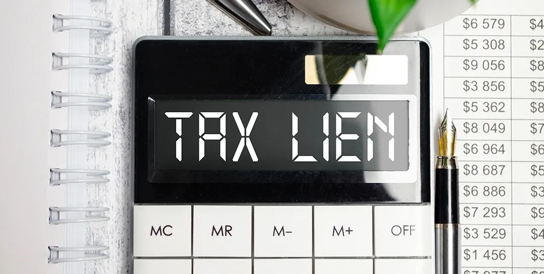Calculator with Tax Lien on the screen.